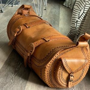 Barrel leather duffel bag. Hand tooled